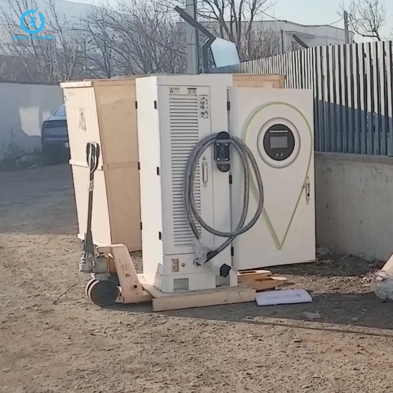 DC EV charging unit placed beside a wooden crate, ready for installation, with charging cables and protective packaging in place.