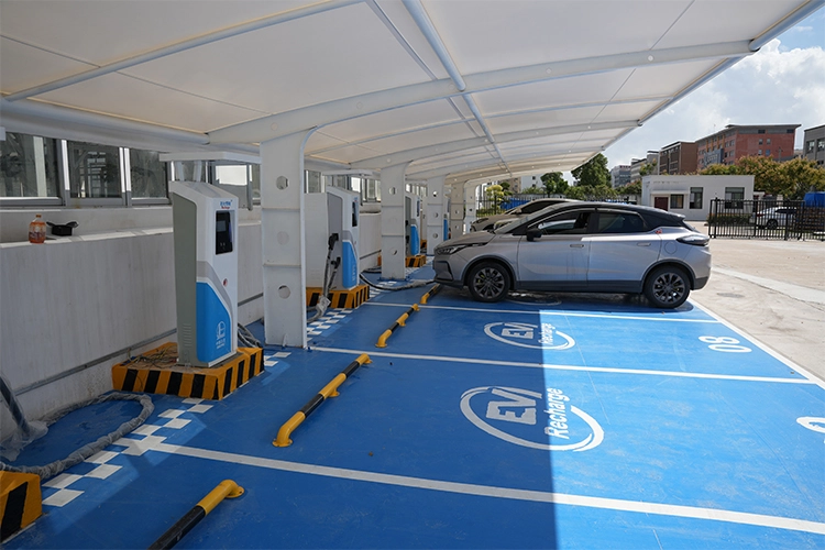 Covered EV charging station with cars charging at multiple points