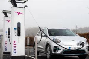 Kia electric car charging at an Ionity EV charging station in Europe, representing the expansion of fast-charging networks and sustainable mobility.