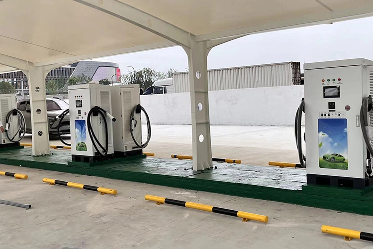 Outdoor commercial EV fast charging station with multiple DC chargers installed under a canopy.