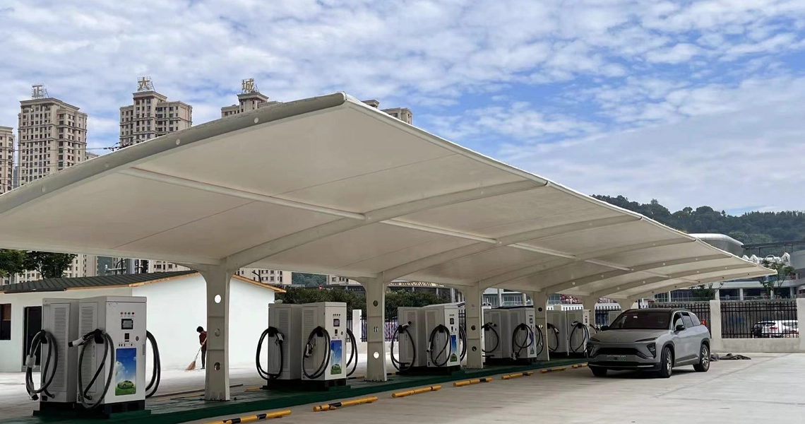 Covered EV charging station with multiple DC fast chargers for public use.