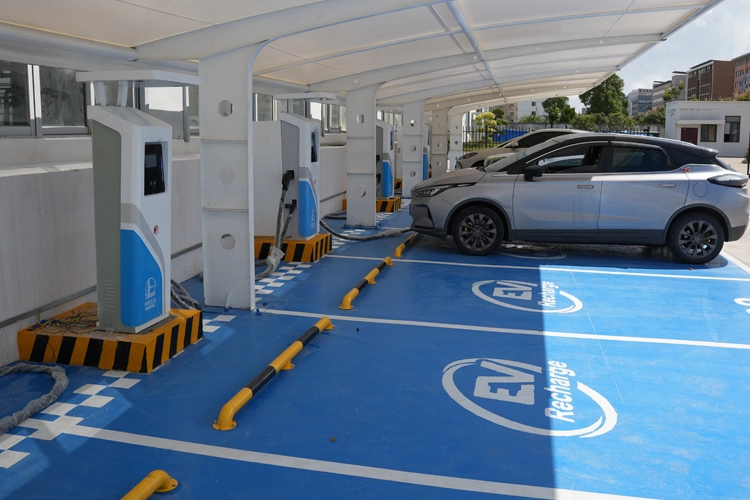 Hotel EV charging station with multiple fast chargers installed in a covered parking area, supporting commercial EV charging solutions.