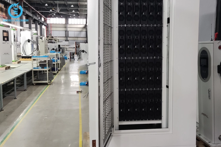 Internal power module cabinet of a Level 3 DC fast charging station displayed inside an EV charger manufacturing facility.