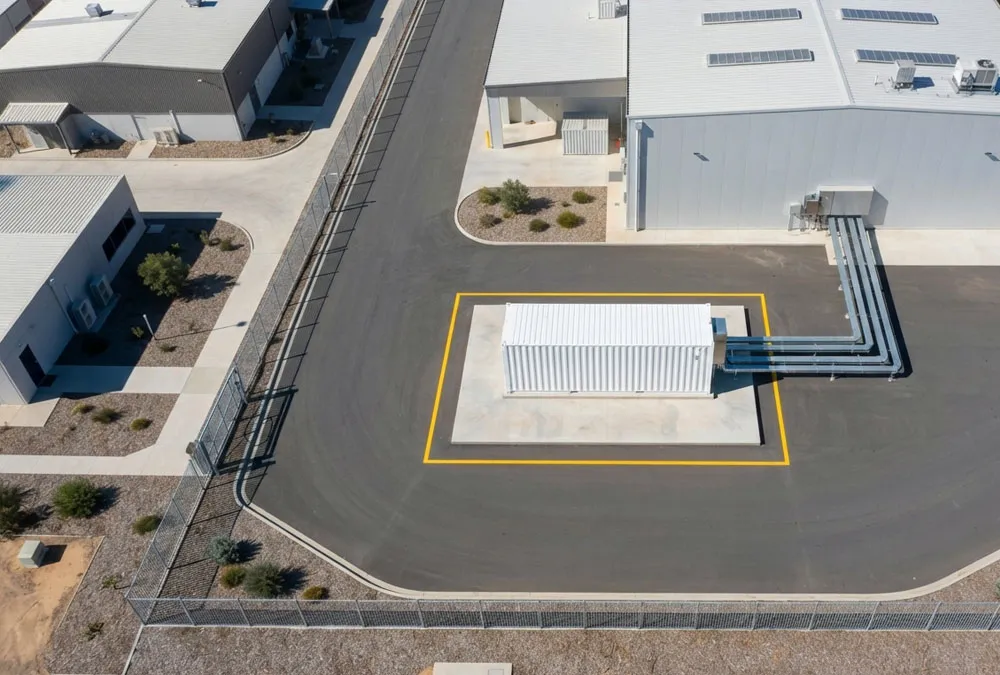 Aerial drone view of a 20ft battery storage container size installation at an industrial factory site